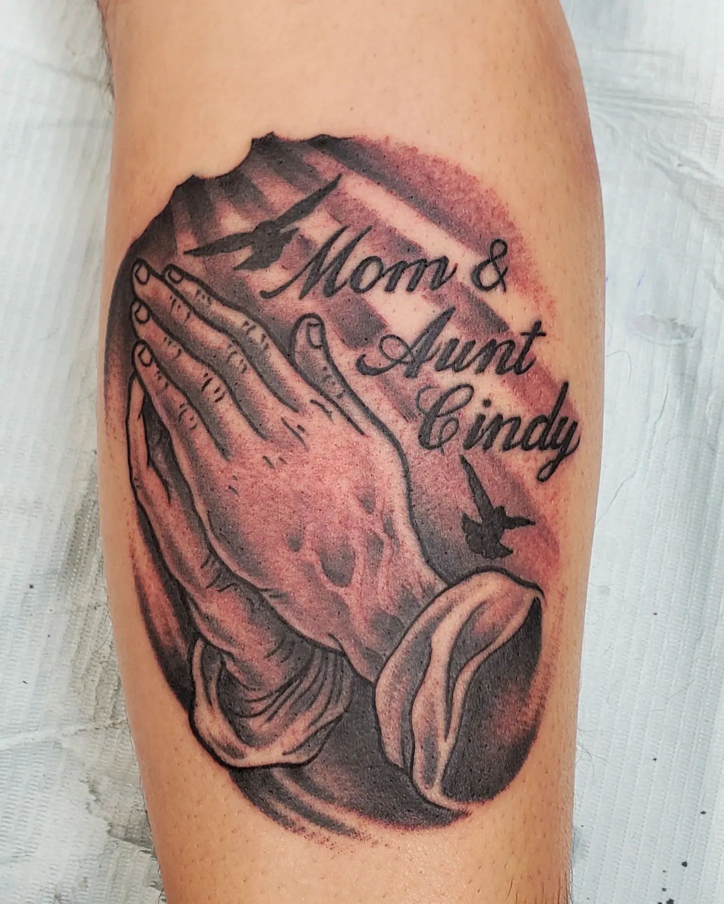 Showing your gratitude to God about having your loved ones in your life is easy with this tattoo. Praying hands with some names on it can be a great choice.