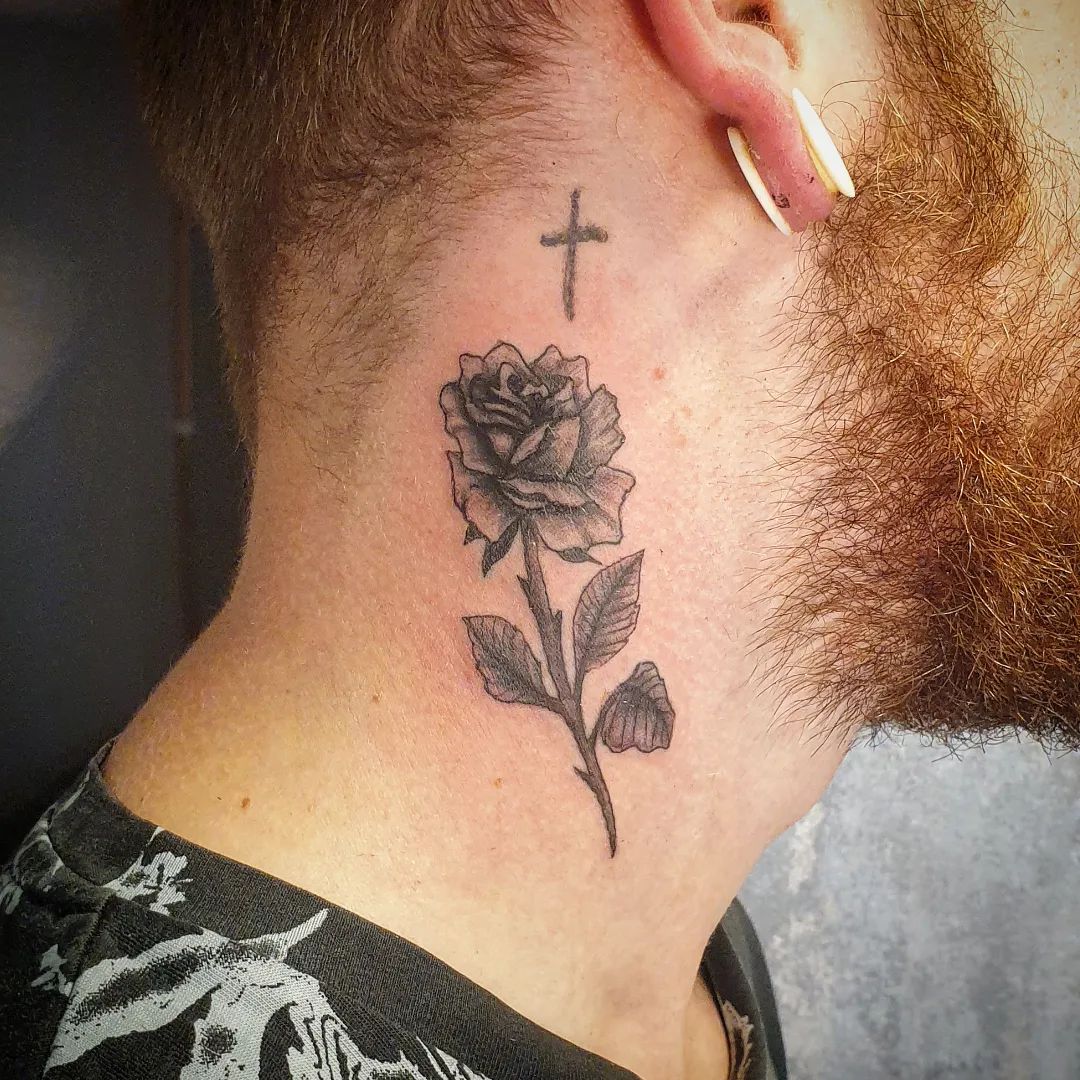 A simple but gorgeous rose tattoo with cross sounds nice. Sometimes people want to go for a simpler design as in the tattoo above. So if you're this kind of people, give this tattoo a shot.