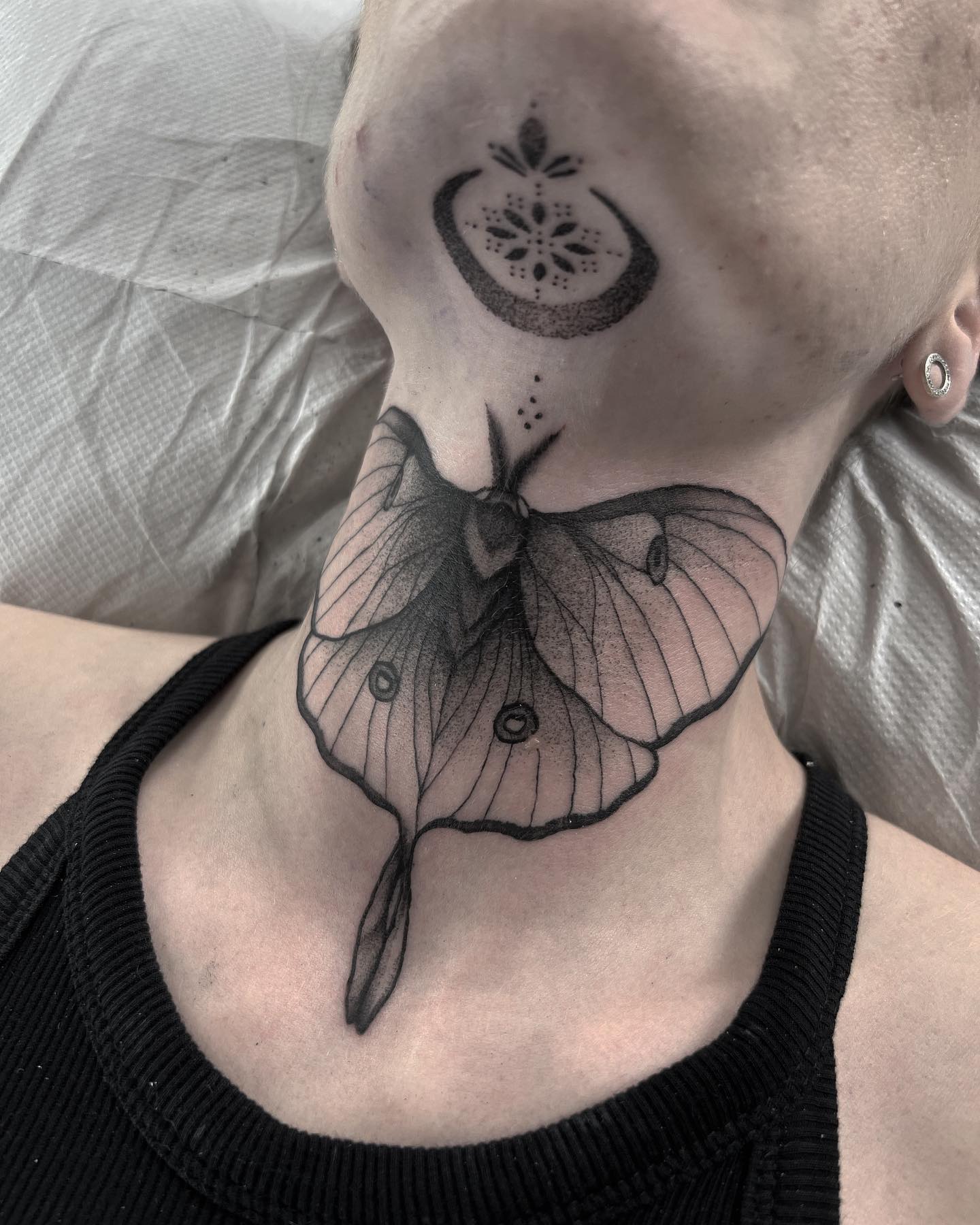  A black butterfly tattoo that is combined with meticulous dotworks. Generally, butterfly tattoos represent the love and romance. So, if you want to demonstrate your romanticism, try this tattoo out.