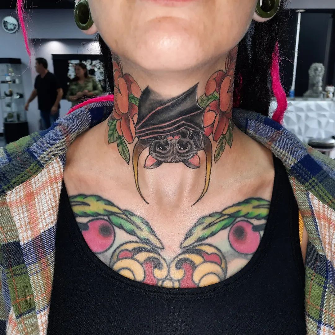 Creepy but cute-looking bat with some colorful flowers and leafs sound nice, doesn't it? While it can mean a sign of death and darkness, a bat design can represent a good luck, too. Give a chance to this marvelous bat tattoo.