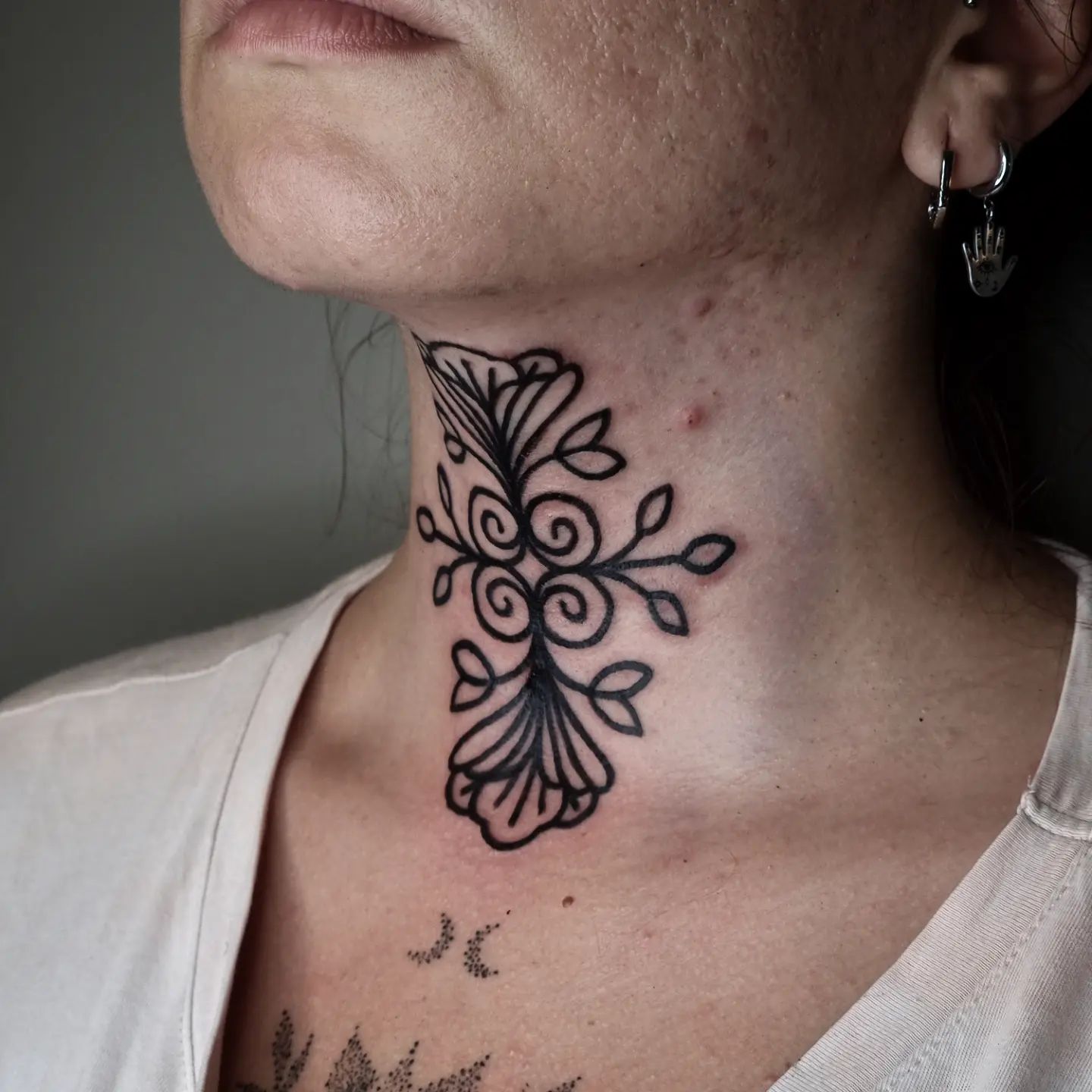 This geometric piece looks very stylish and ideal in terms of size. Flower and leaf details show the perfection of nature in a harmony. Also, if you like black tattoos more than colorful ones you can give a chance to this nice looking tattoo.