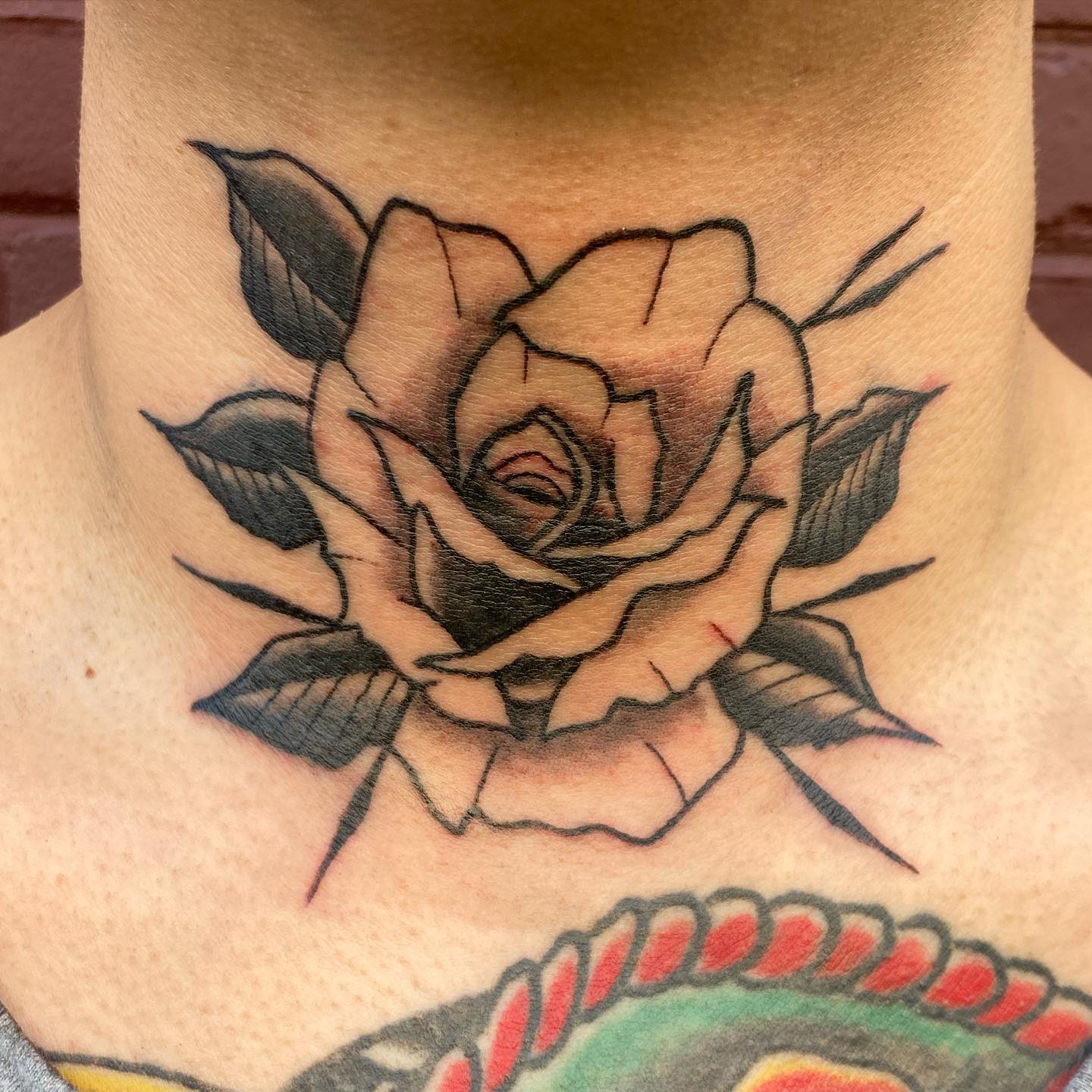 Rose tattoos are one of the most demanded tattoos and it's not strange to hear that because they symbolize love and passion. Also, they look great on every part of body. Without doubt, this tattoo will be a great companion on your throat too.