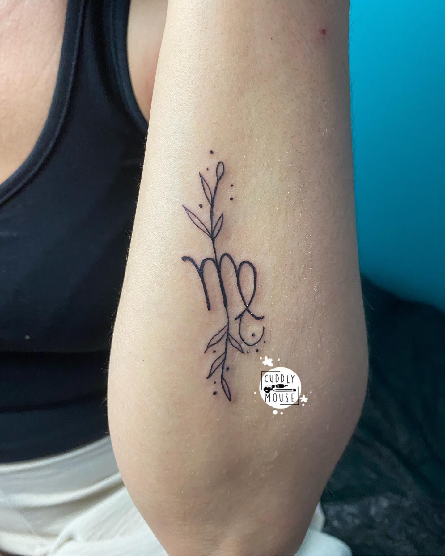 You can get a simple Virgo tattoo on your forearm if you are a minimalist tattoo person. The branches that come out of the sign give this tattoo a chic look.