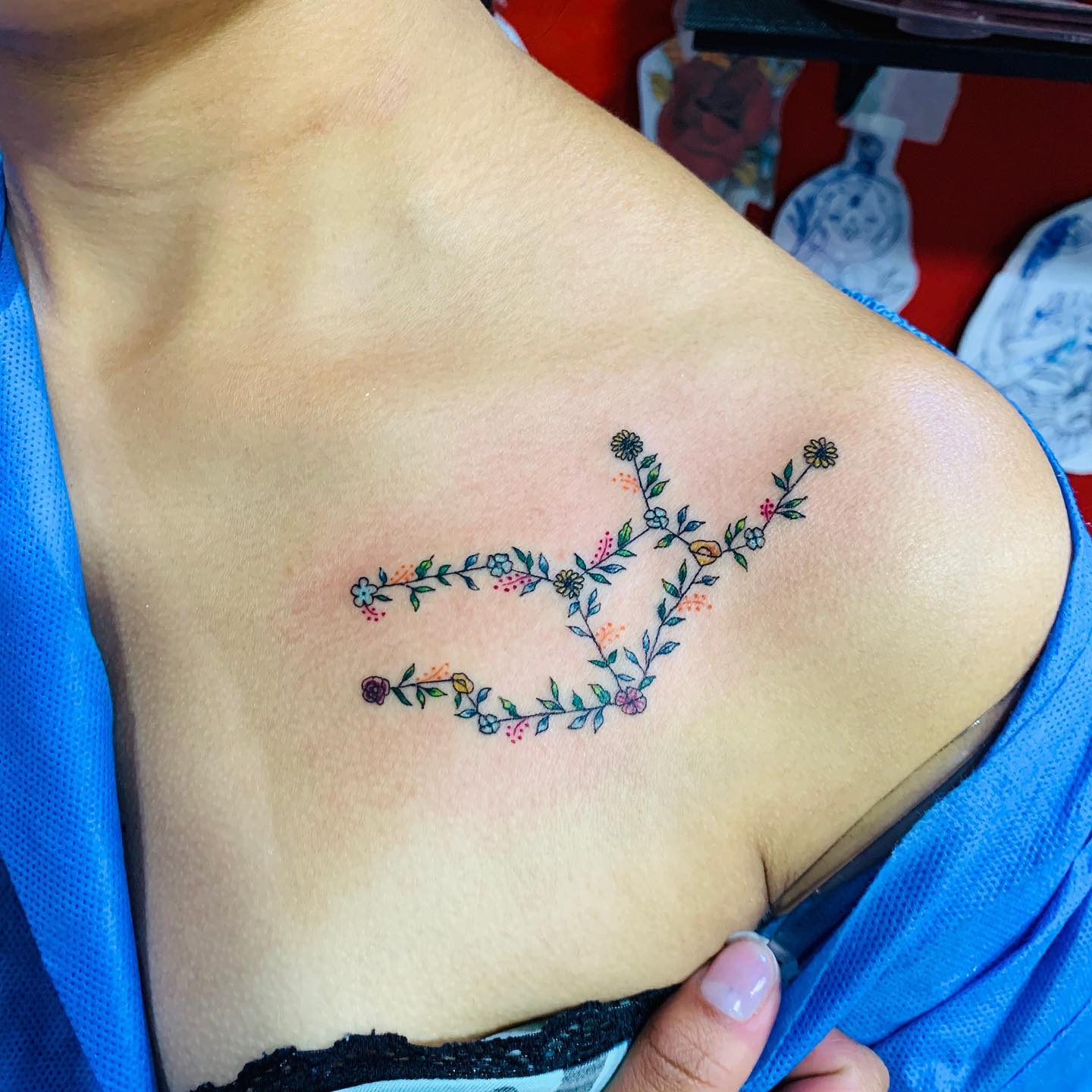 Floral tattoo designs have been always popular. The example above shows a perfect Virgo constellation with some flower decoration. Are you ready to rock?