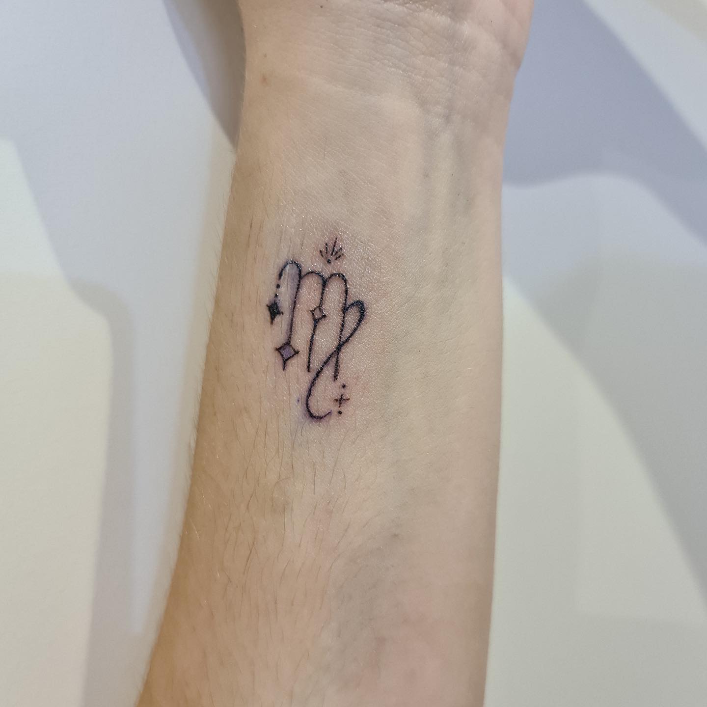A small and ornamented Virgo tattoo sound nice, doesn't it? Minimalist tattoo lovers must go for it.