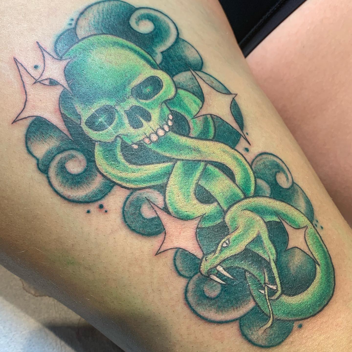The green death eater tattoo is quite amazing! I think it's so cool that you've been able to take a concept from a fantasy book and turn it into something that's totally unique with a tattoo.