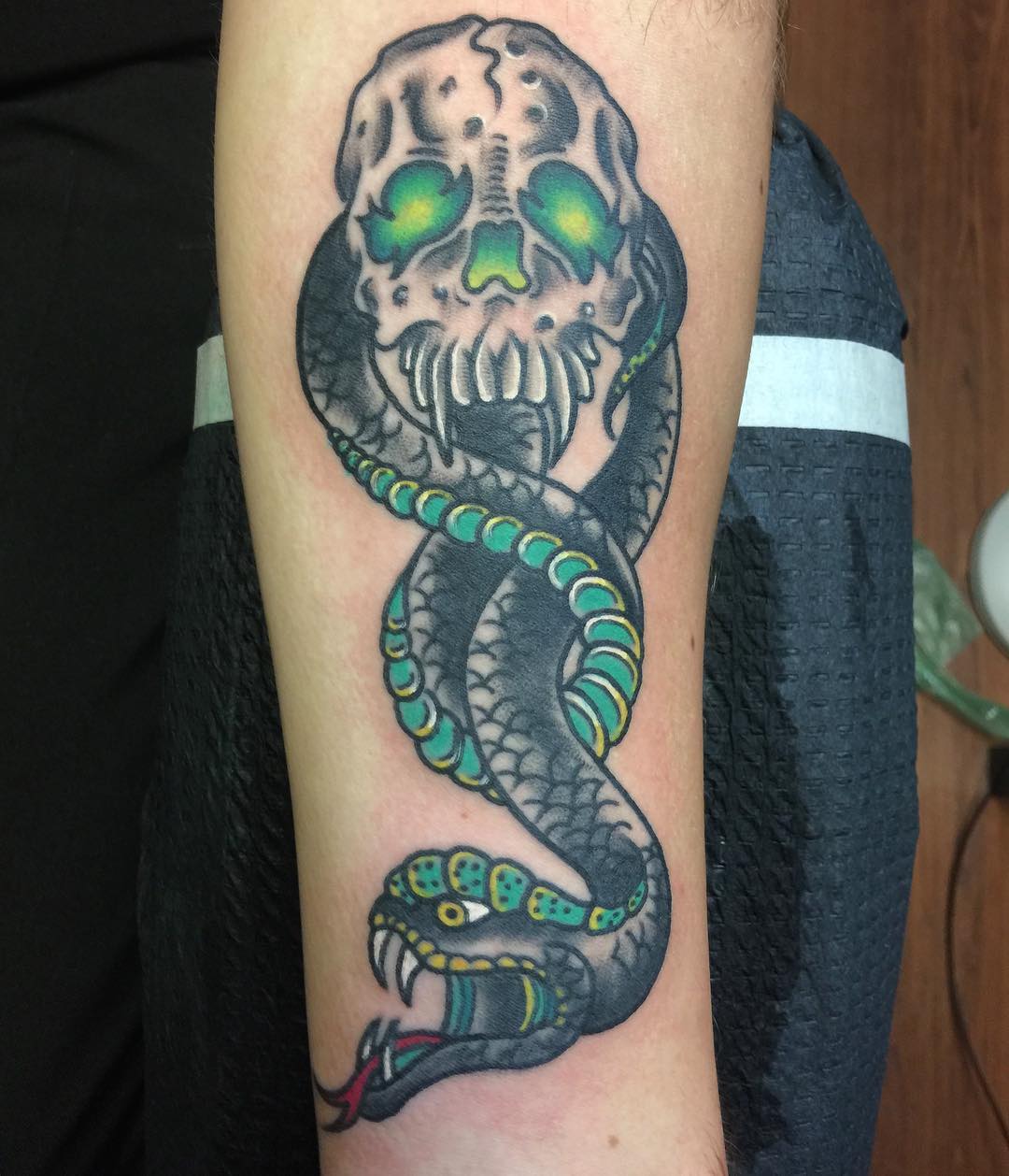 Are traditional tattoo lovers here? This death eater tattoo is for you since a traditional tattoo technique is used here. To feel the old vibes, this is the one you should go for.
