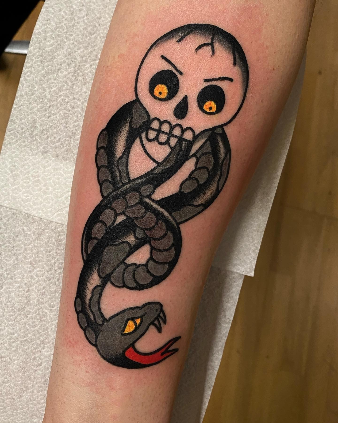This is a very cool tattoo for someone who likes the Harry Potter series and wants to get a scary tattoo. The yellow eyes are a nice touch.