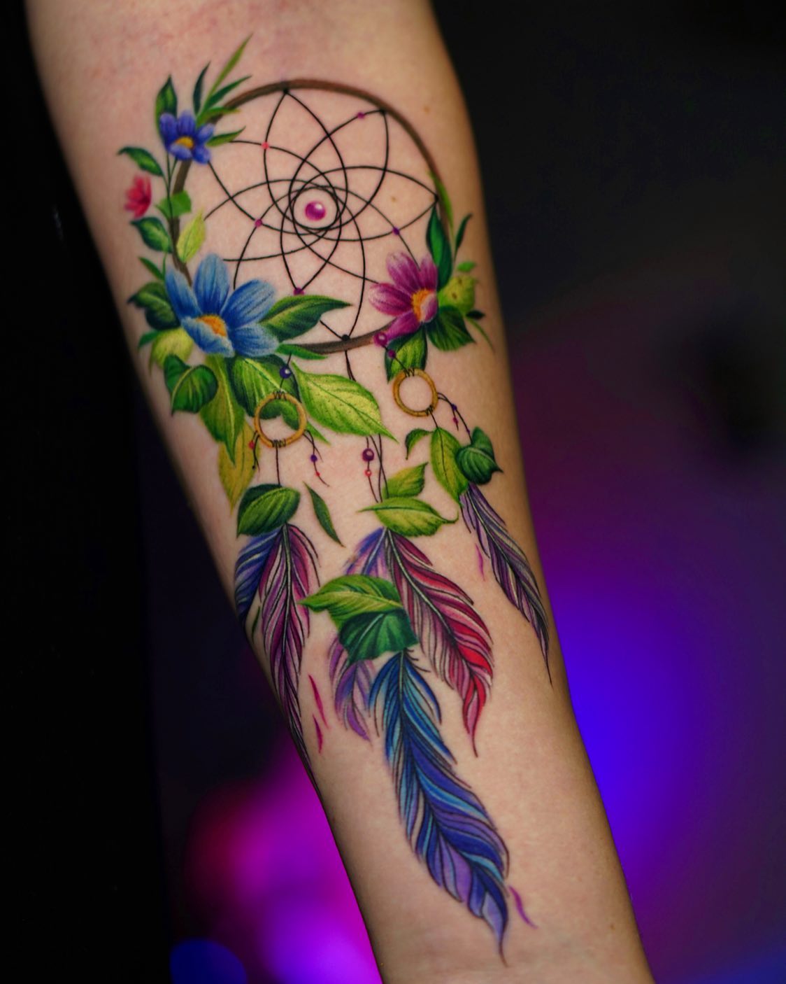 purplepinkbluefeathersflowersdreamcatchertattooformenforearm tattoo  Forearm tattoos Tattoos for guys Dream catcher tattoo