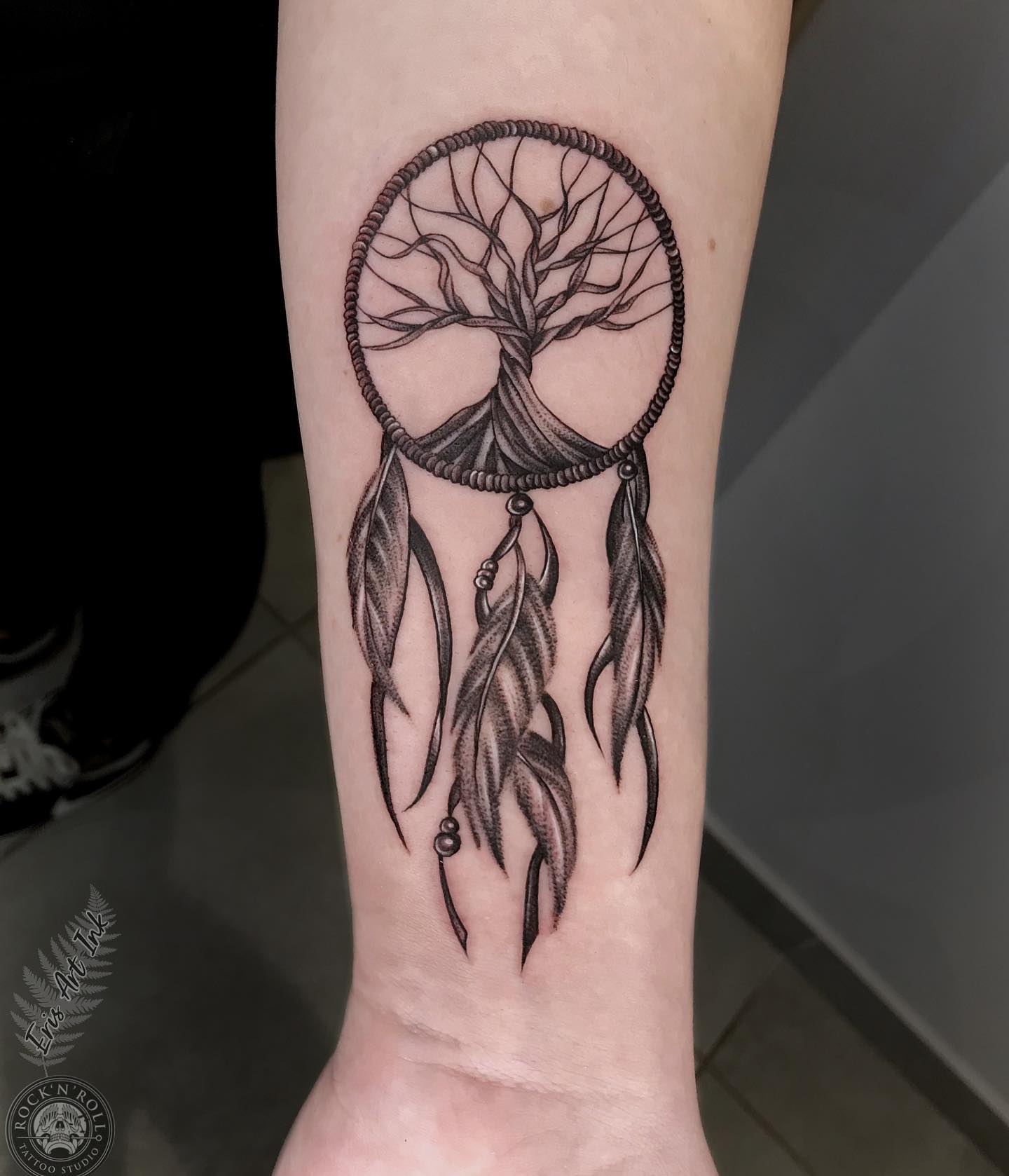 A dream catcher tattoo with a tree of life is a symbol of protection, hope, and happiness. It's used to capture bad dreams and let good ones pass through. The tree represents the universe, and the dream catcher stands for your dreams.