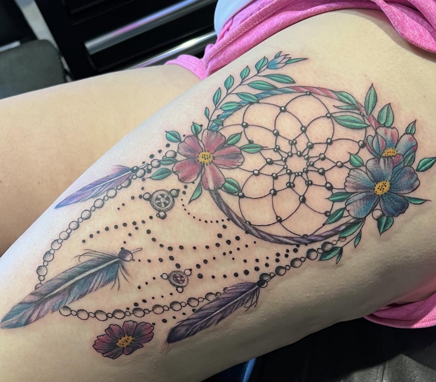 If you are into flowers and cannot imagine a tattoo design without them, then this tattoo idea is for you! Let's match the beauty of flowers with a dream catcher, which represents hope for the future.