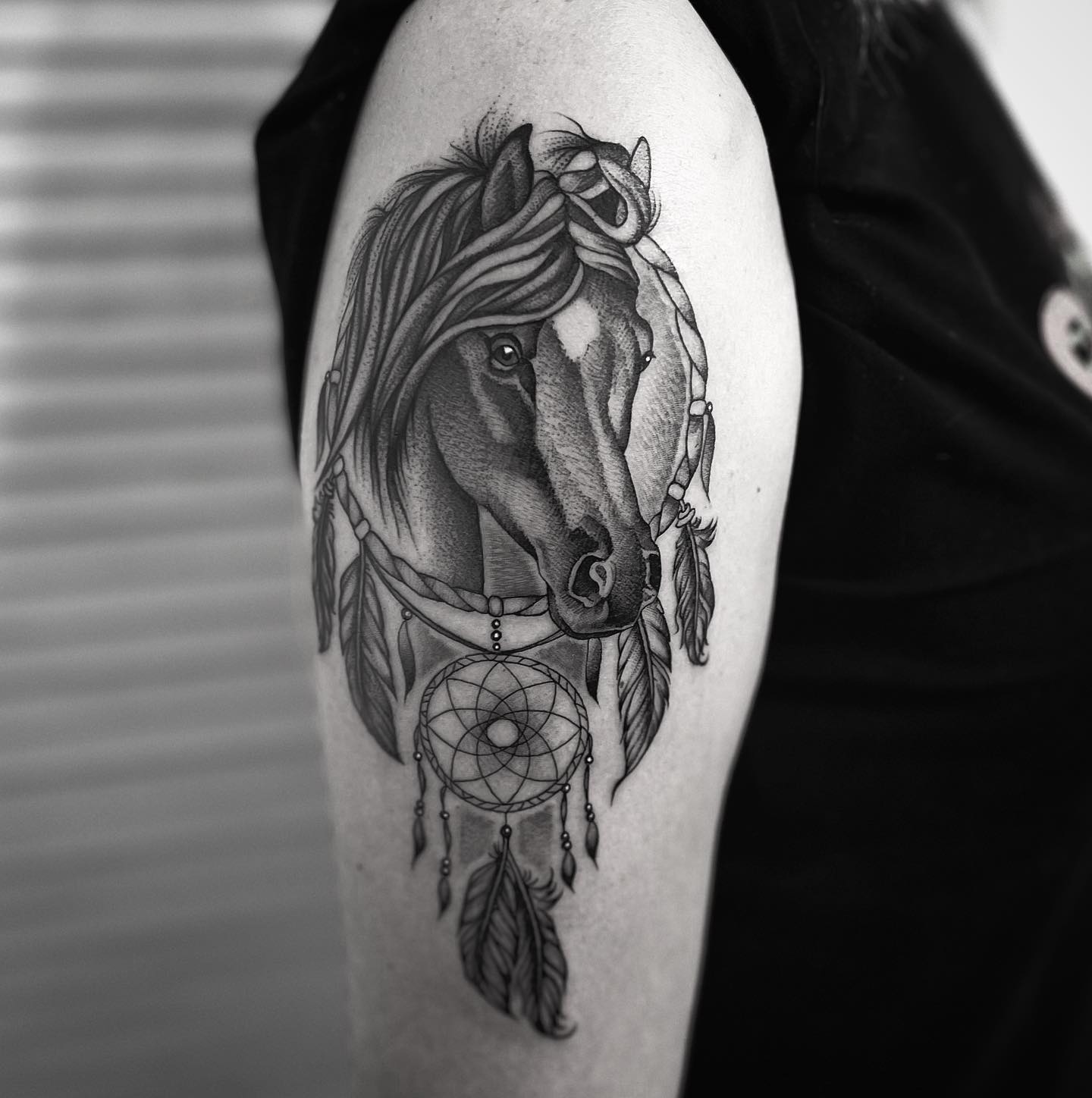 The horse represents freedom, strength, and speed. When these two symbols are combined in one tattoo, it means that you want to free yourself from your bad dreams and achieve unlimited potential. Doesn't the horse look amazing?