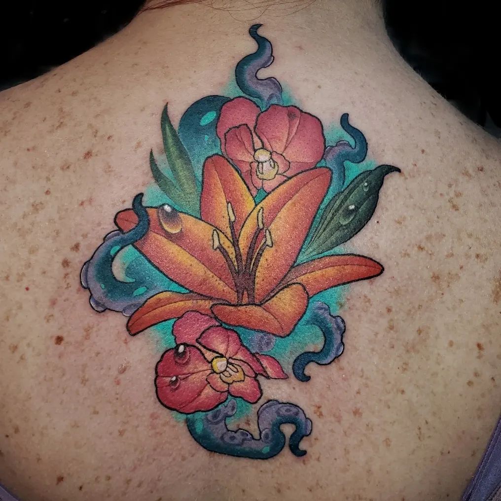 Can you spot the octopus and seaweed above? It's a tattoo that has been inspired by the beauty of nature and the ocean. It is meant to be worn by those who want to show their love for the sea and all of its inhabitant with a beautiful lily.