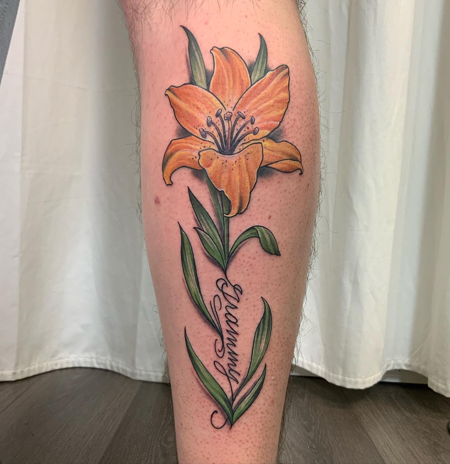 Orange lily tattoos rock! Orange lily is a symbol of hope, faith and new beginnings. It is worn by people who have been through a lot of change in their lives or who have just started off on a new journey