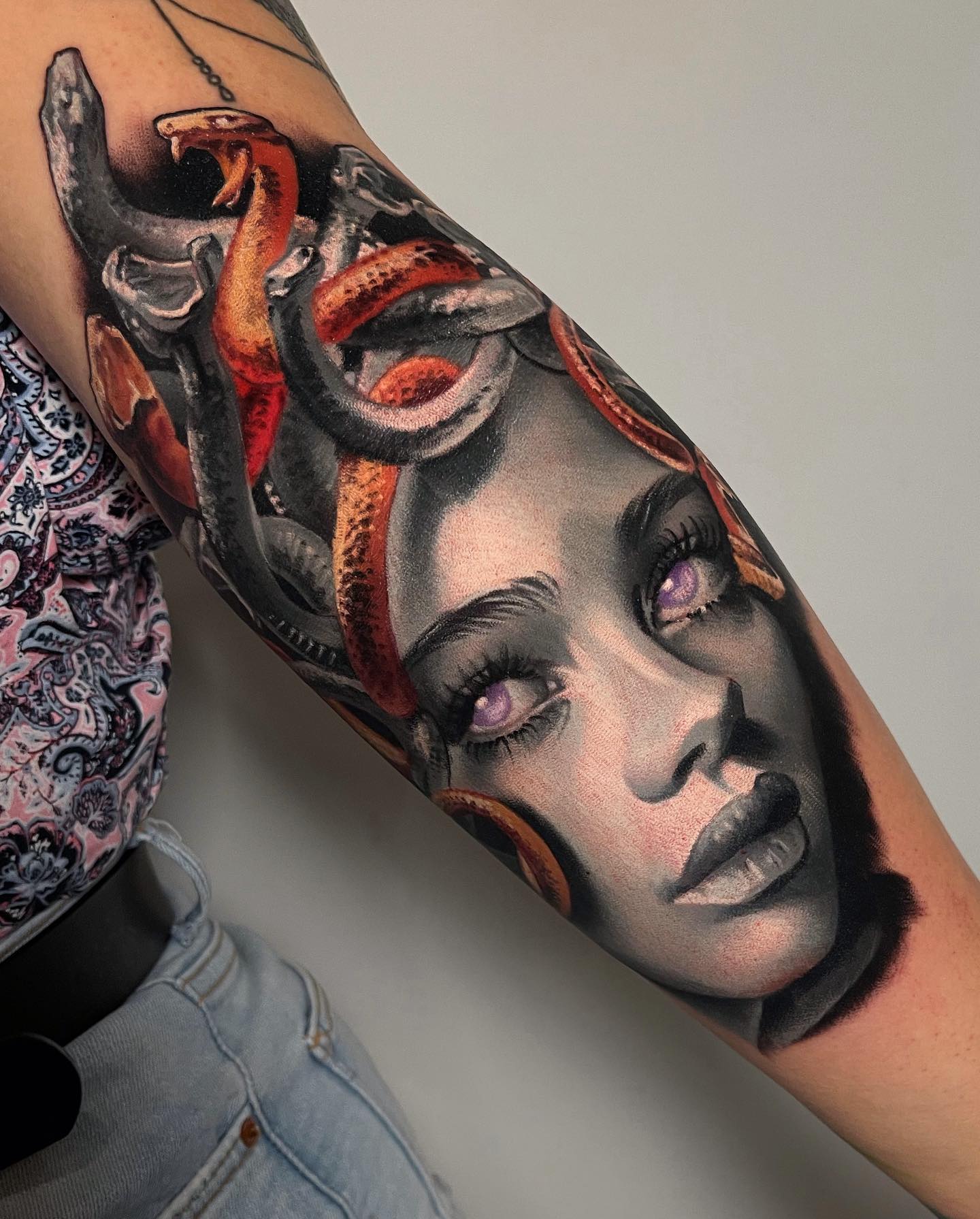 To create a detailed tattoo like this, tattoo artists spend a lot of time and as we can see above, it totally worths it! Grey-faced Medusa has purple eyes, which are the symbols of strength. This realistic tattoo will show everyone that you have a good taste.