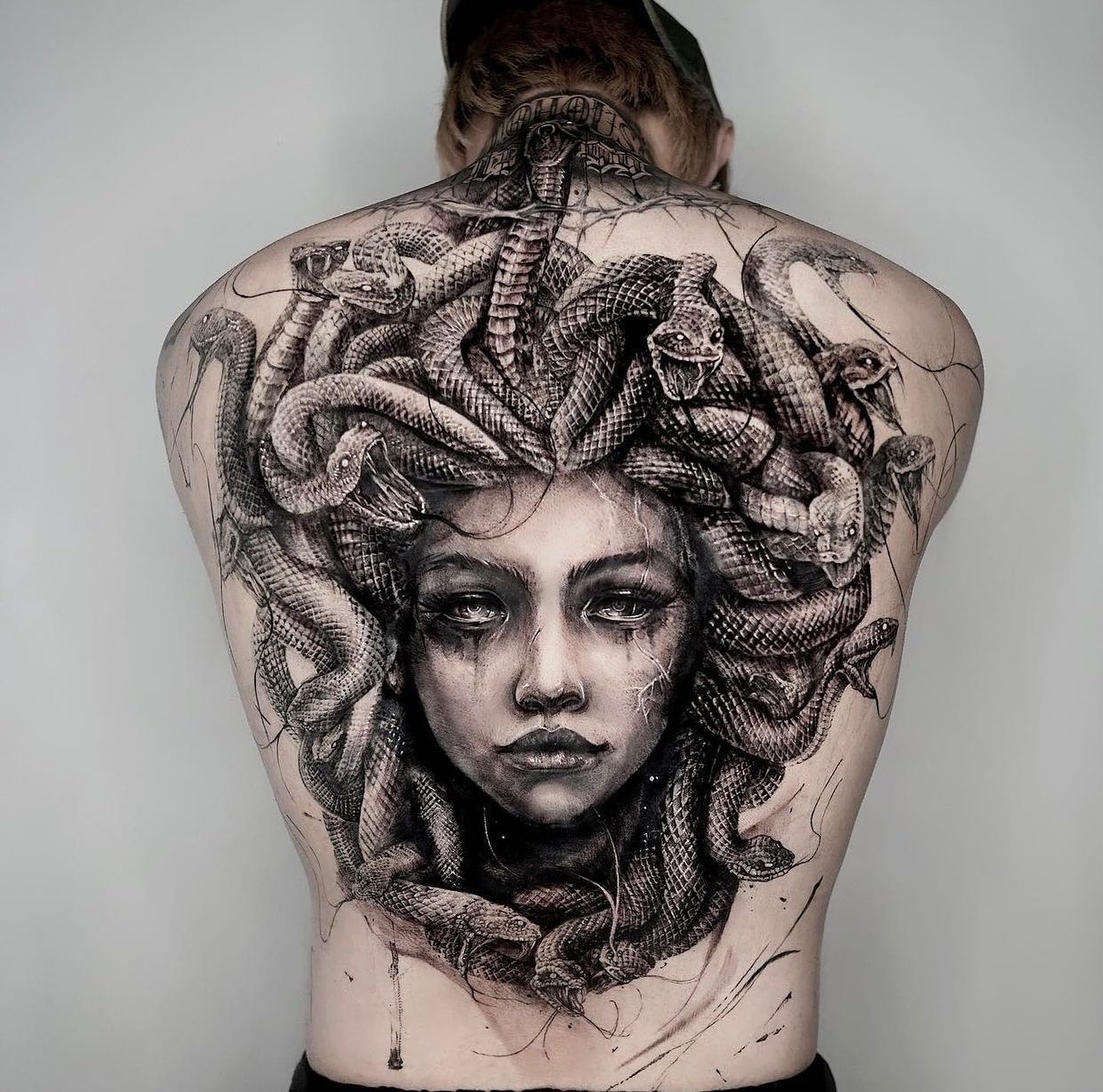 Here is a big-size tattoo to adore. Sometimes minimalist tattoos are not enough to show your tattoo to everyone. So, why don't you try to cover up all of your back with Medusa? All of its shading and perfect details will remind you the power of women.
