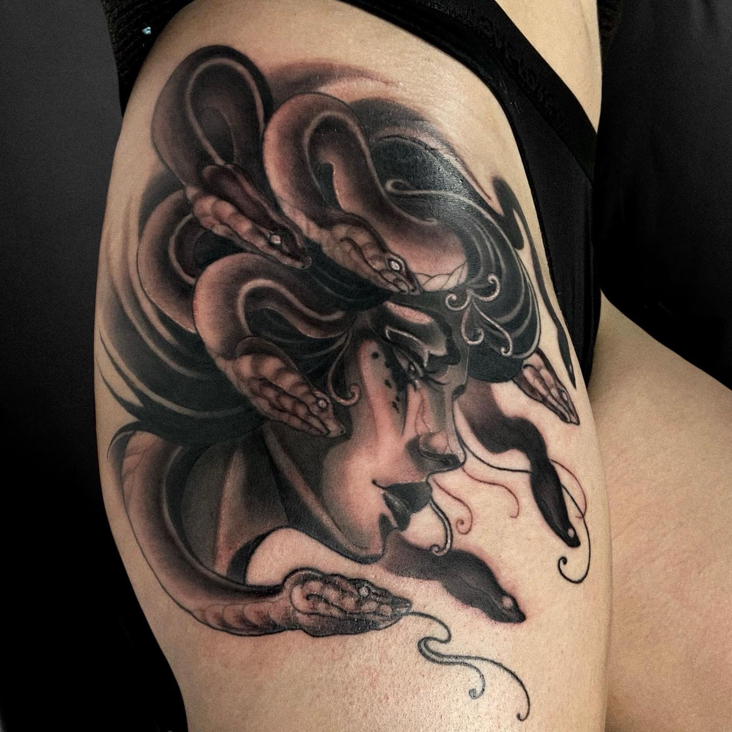 It's absolutely stunning! The side portrait of Medusa is drawn in a way that it looks perfect. You will feel the power of medusa on your upper arm, so what are you waiting for to get it?