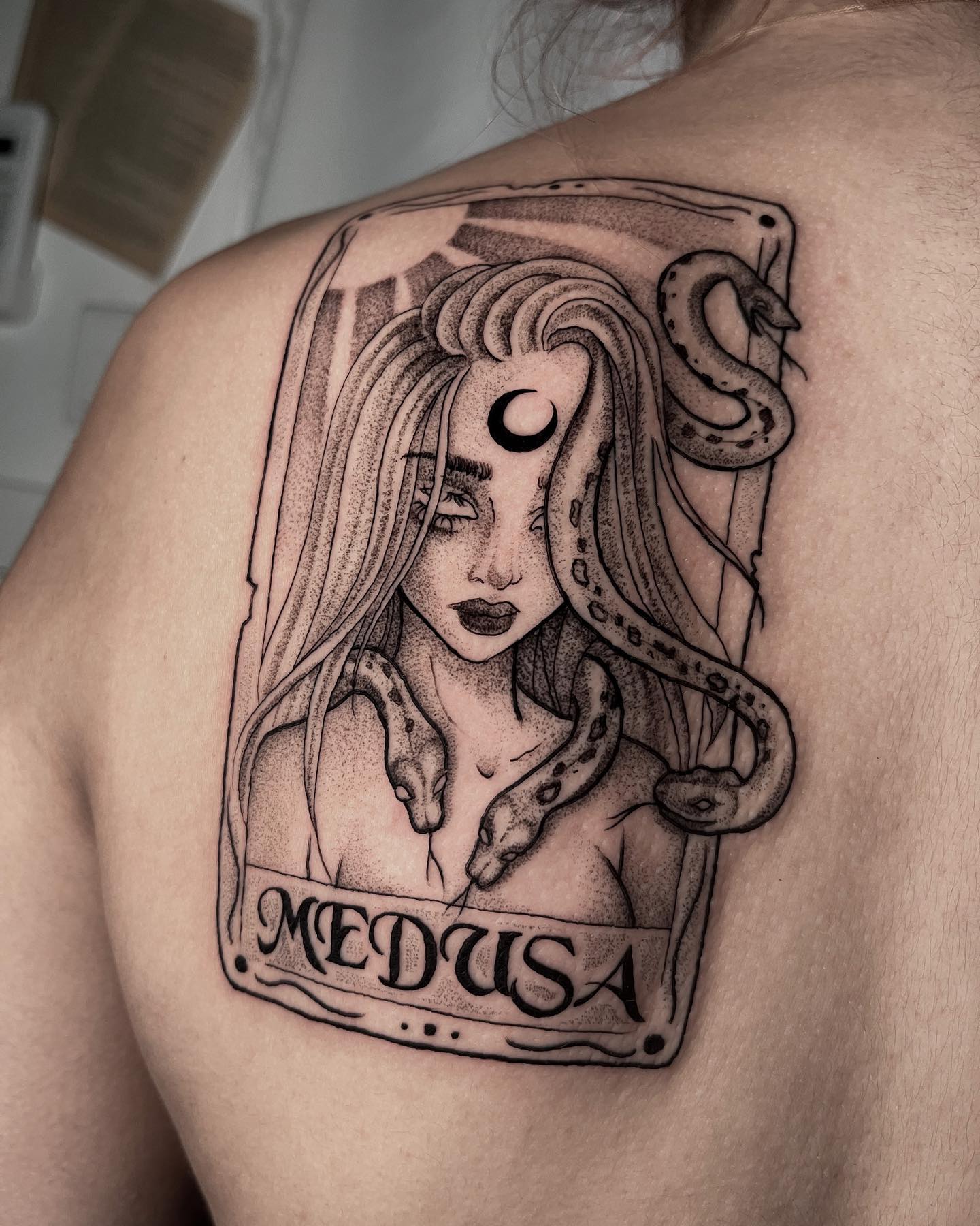 Tarot cards symbolize different meanings according to who is shown in the frame. In this creative tattoo, Medusa is placed in it. It's a wonderful one since Medusa is a archetypal femme fatale. Death, erotic desire and violence are one of its meanings.