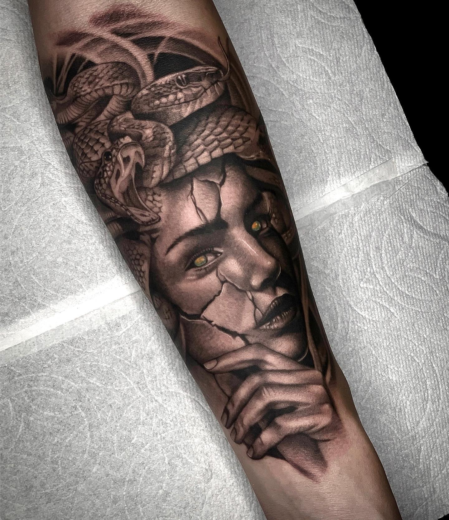 Medusa is looking for revenge this time. As you see above, Medusa's face is cracked but she is still alive. This may mean that nothing can stop her from being strong and brave. With this powerful meaning, let's get this arm tattoo to cover your arm.