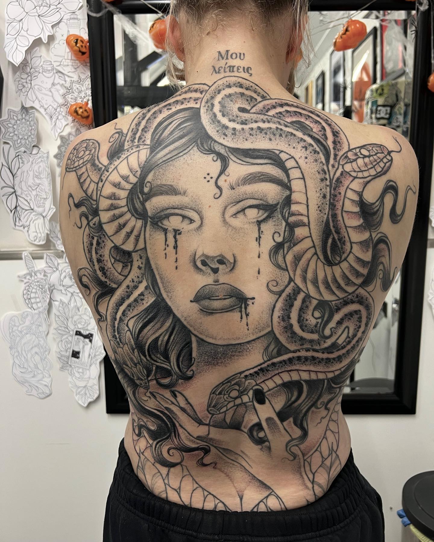 Wanna cover up your back with a Medusa tattoo? Then, you should get the one above since it offers a look that is hard to ignore. It seems like Medusa shows her beautiful side while showing her evil side at the same time.