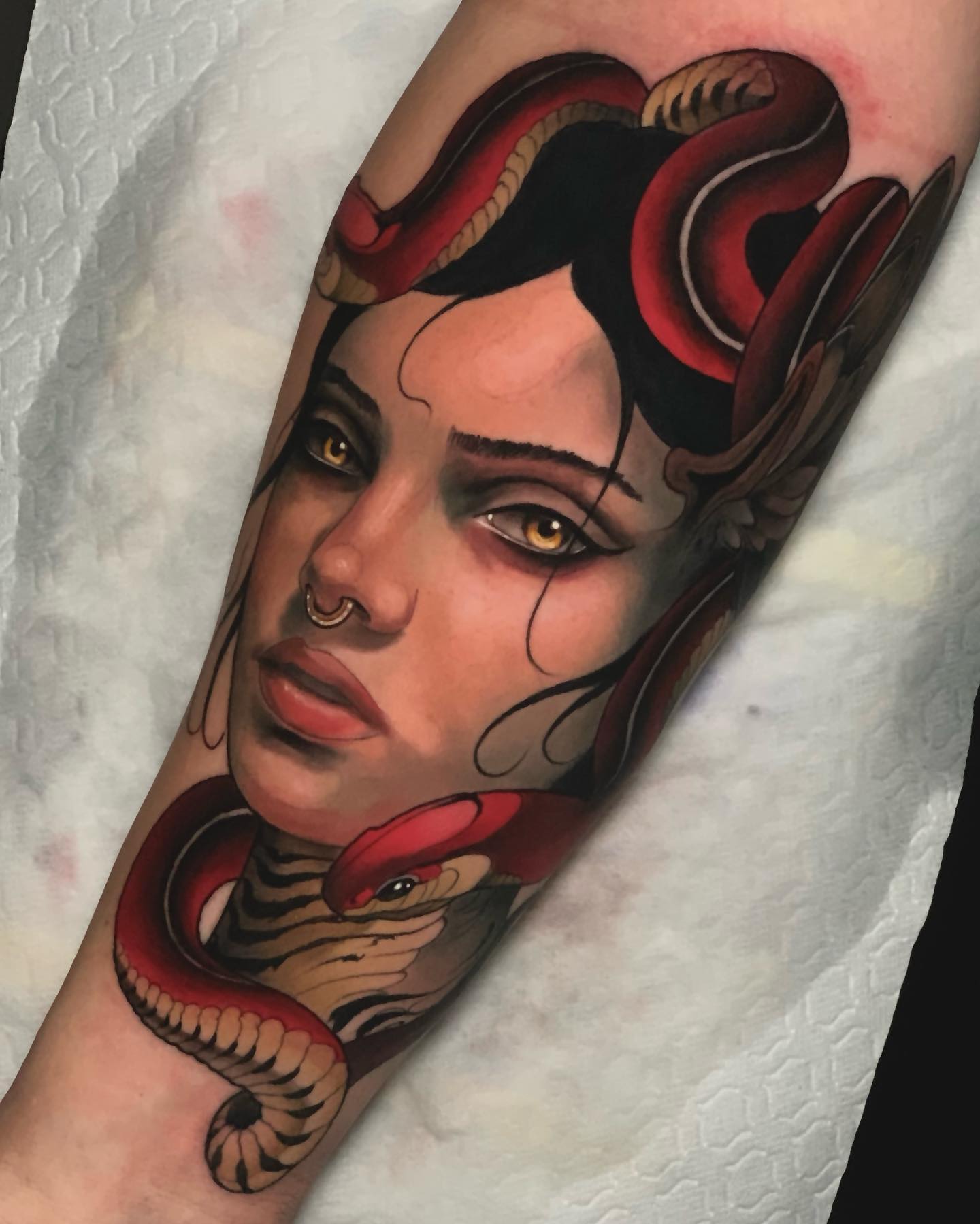 Can you spot the aesthetic details here? This is an example of a Neo-traditional tattoo which is known for its dense aesthetics. The colors look matching with each other in a great way.