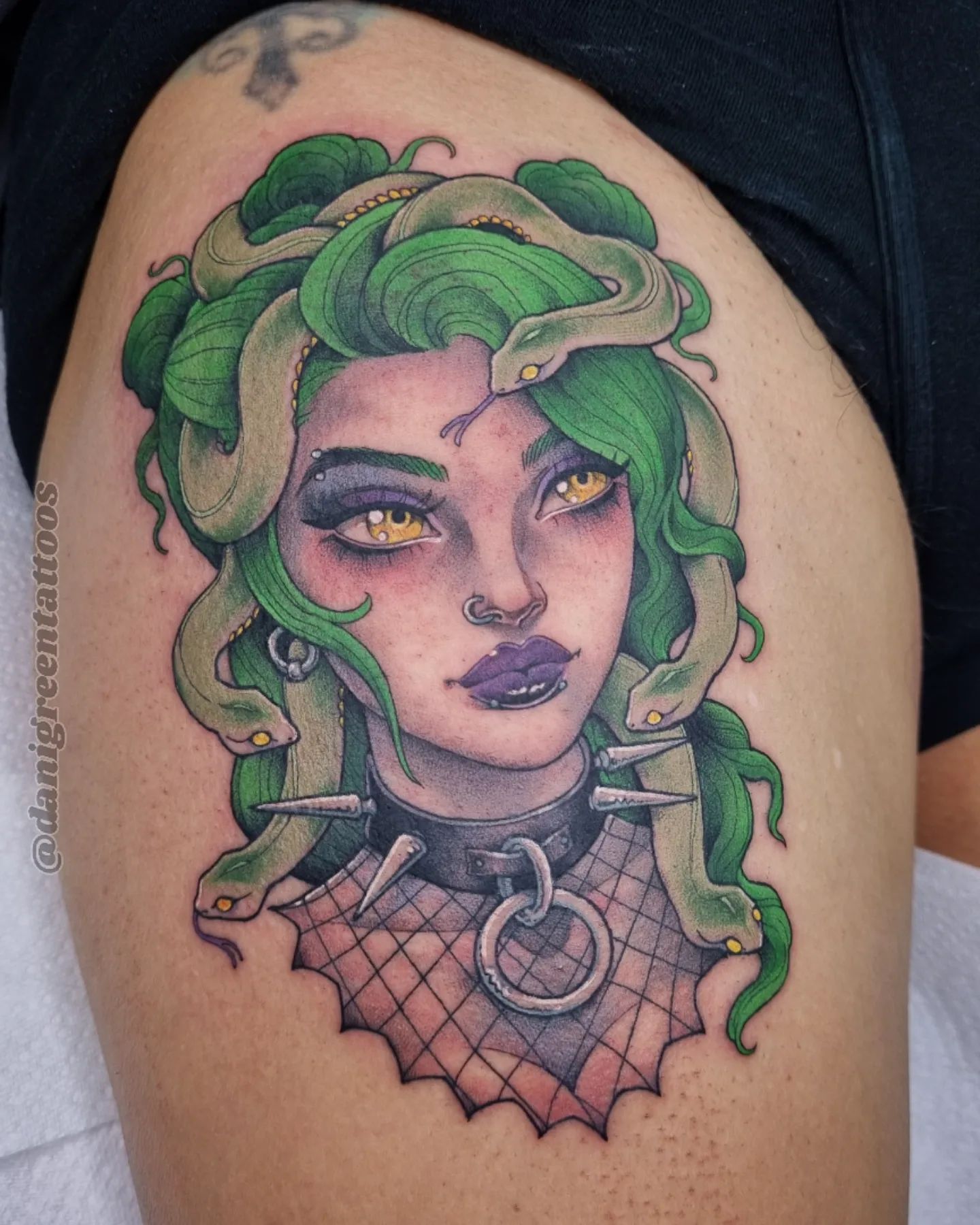 Have you ever seen such a punk Medusa like that? She is wearing a gothic necklace and her body is covered with nets, which is super cool. Plus, green hair and purple lips make a strong statement.