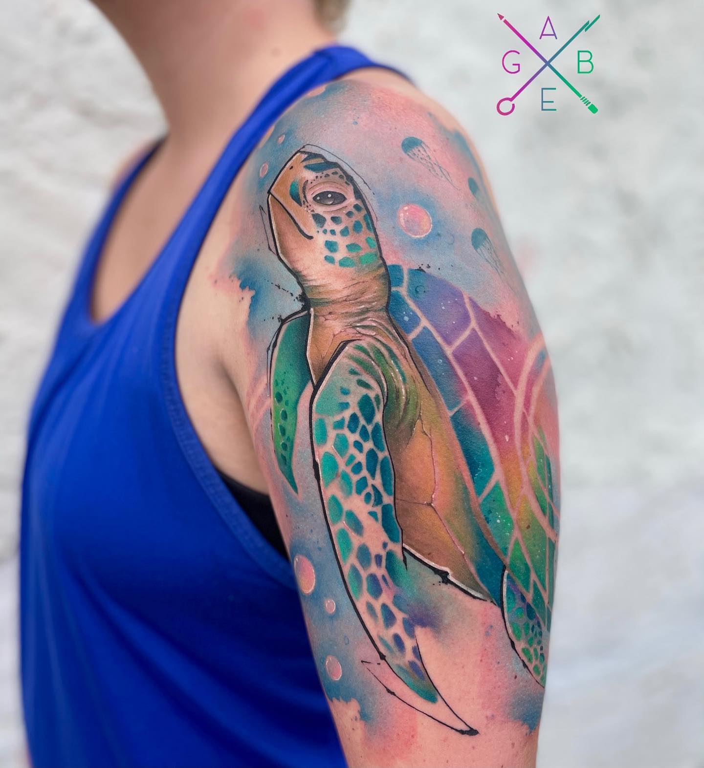 A big size sea turtle tattoo is ready to make your arm stand out more than ever! It's so soft and dreamy. Blue background looks extra soft and soothing at the same time. Go for it without any hesitation.