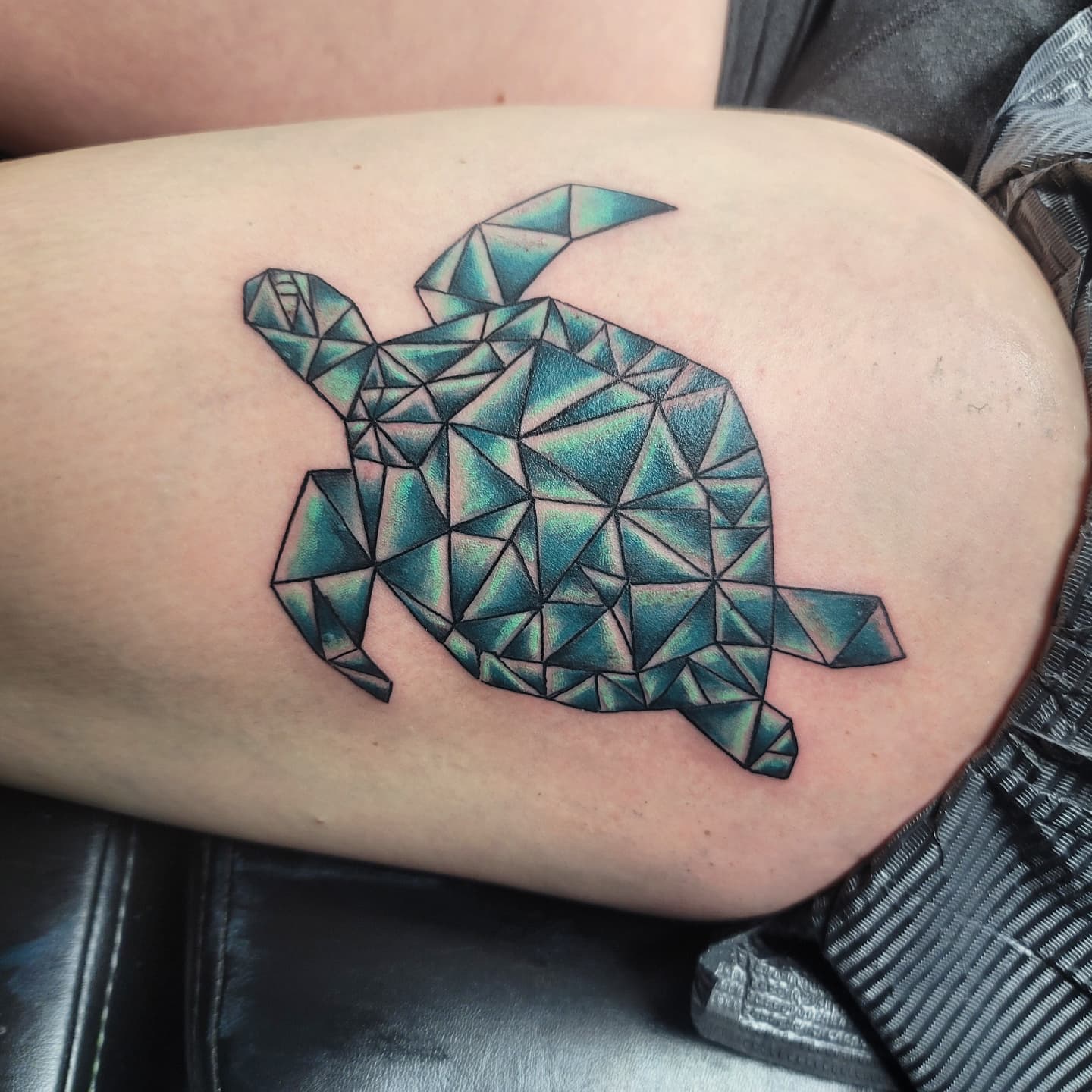 The abstraction of this tattoo is adorable! It's so cool how the artist was able to take these shapes and create sea turtle. Why don't you give it a shot?