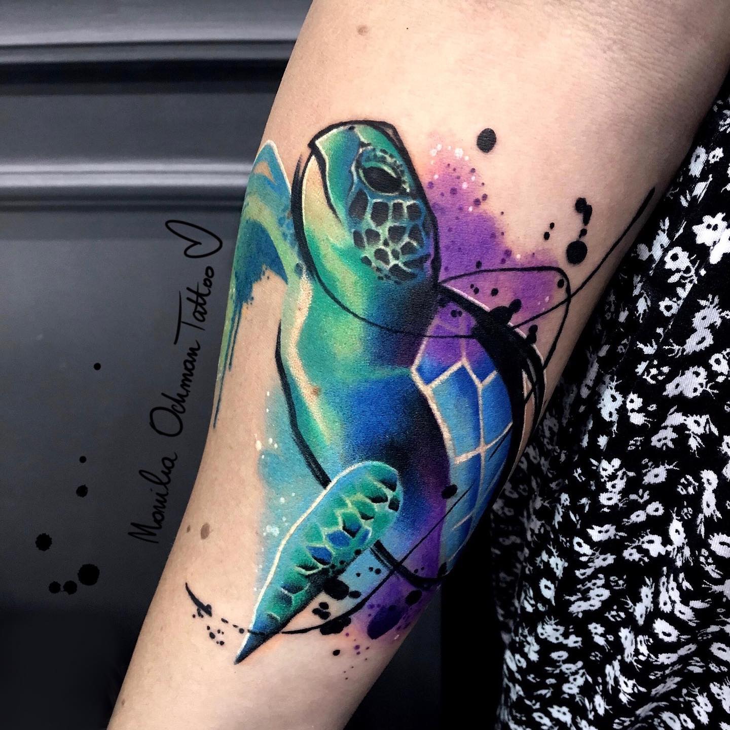 Green, blue and purple colors create a great combination! It's like a rainbow exploded all over the sea turtle tattoo! Your arm will definitely shine out with it.