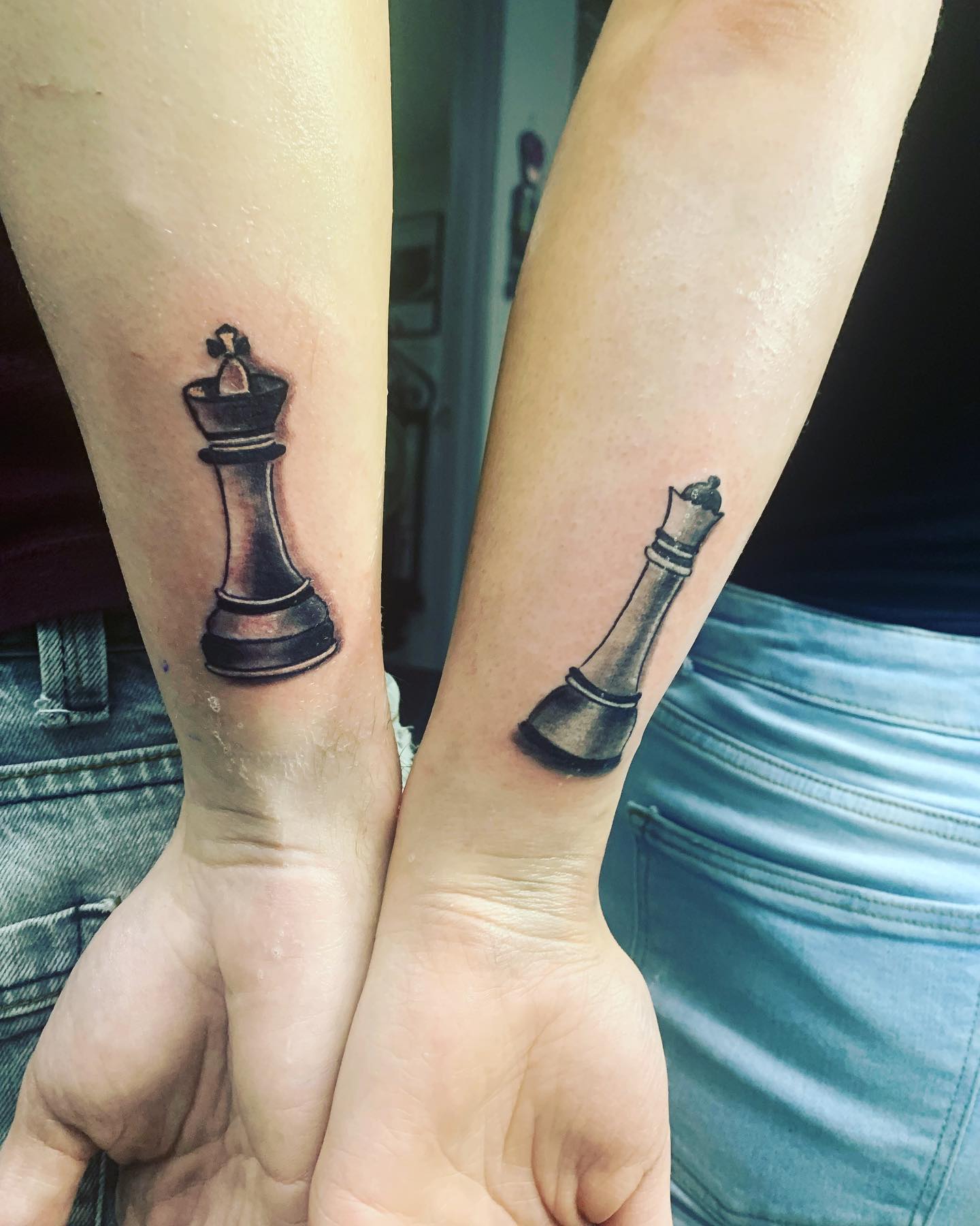 Small rook piece tattoo on the left bicep