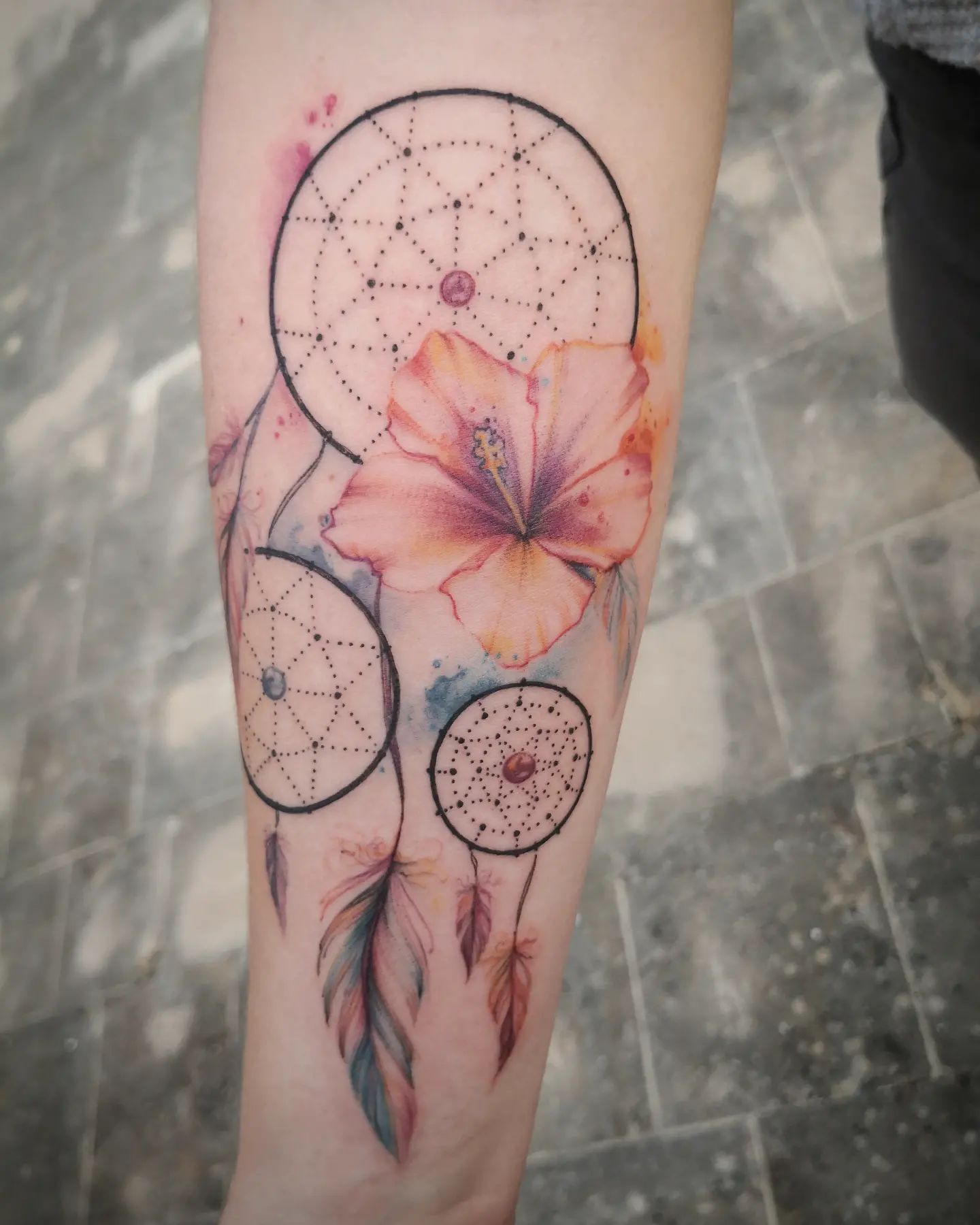 The Dream Catcher trio tattoo symbolizes the three people who have a special place in your heart. It also represents how these people are connected to each other in your life and how they will always be there for you.