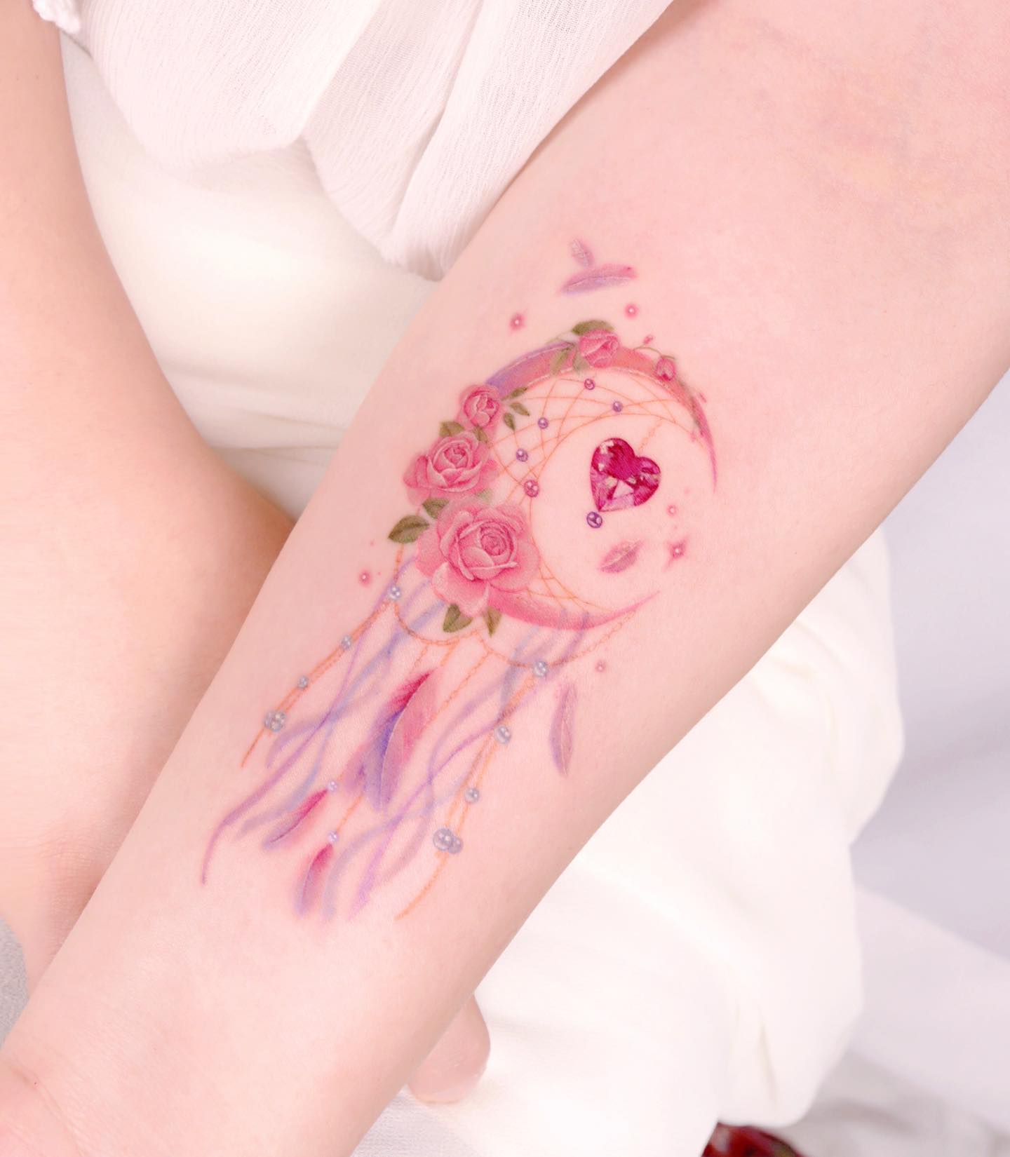 Pink dream catcher tattoo is a tattoo that looks like a dream catcher. It's usually worn by girls who want to look cute while also showing their love for tattoos. The one above is definitely one of the best dream catcher tattoos!