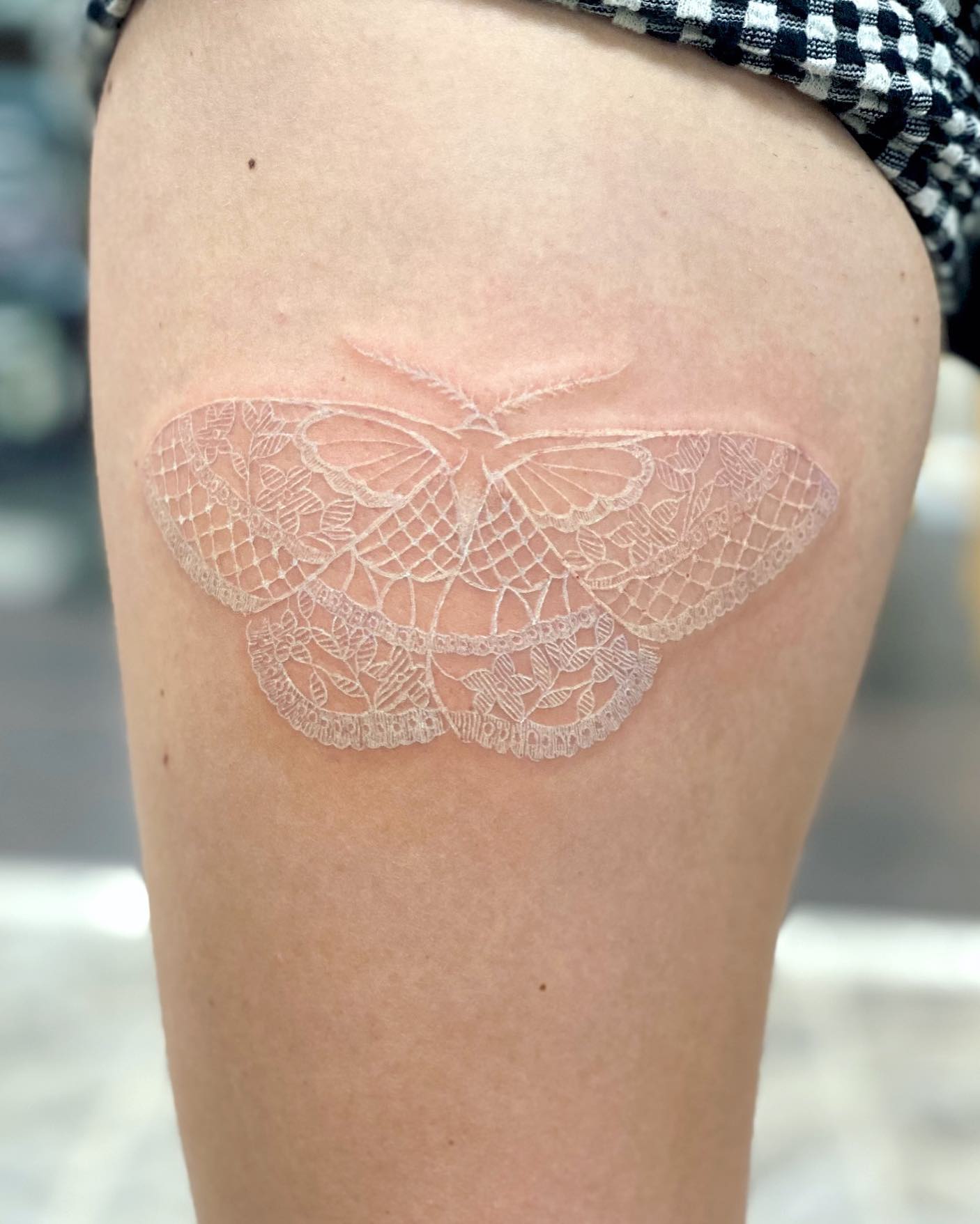 Butterfly tattoos are so pretty in that they offer a cute look. Also, they can be used as a symbol of change or rebirth, which is pretty cool. For its wings, something creative can be used like a lace. Go for a white ink tattoo of it to show its innocence to the fullest.
