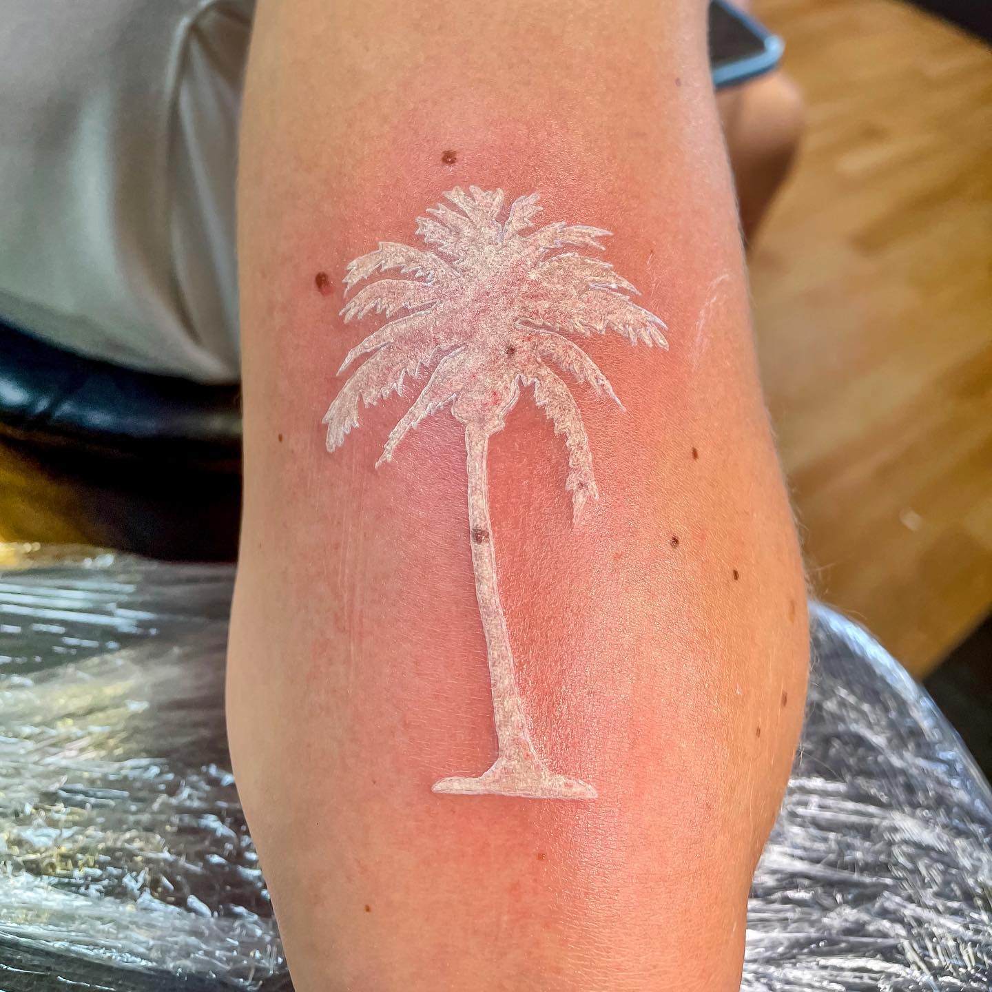 Palm tree tattoos represent two things: regeneration and immortality. No matter for which symbolism you get it,  a white ink palm tree is sure to make you feel great. Let's go and get it!