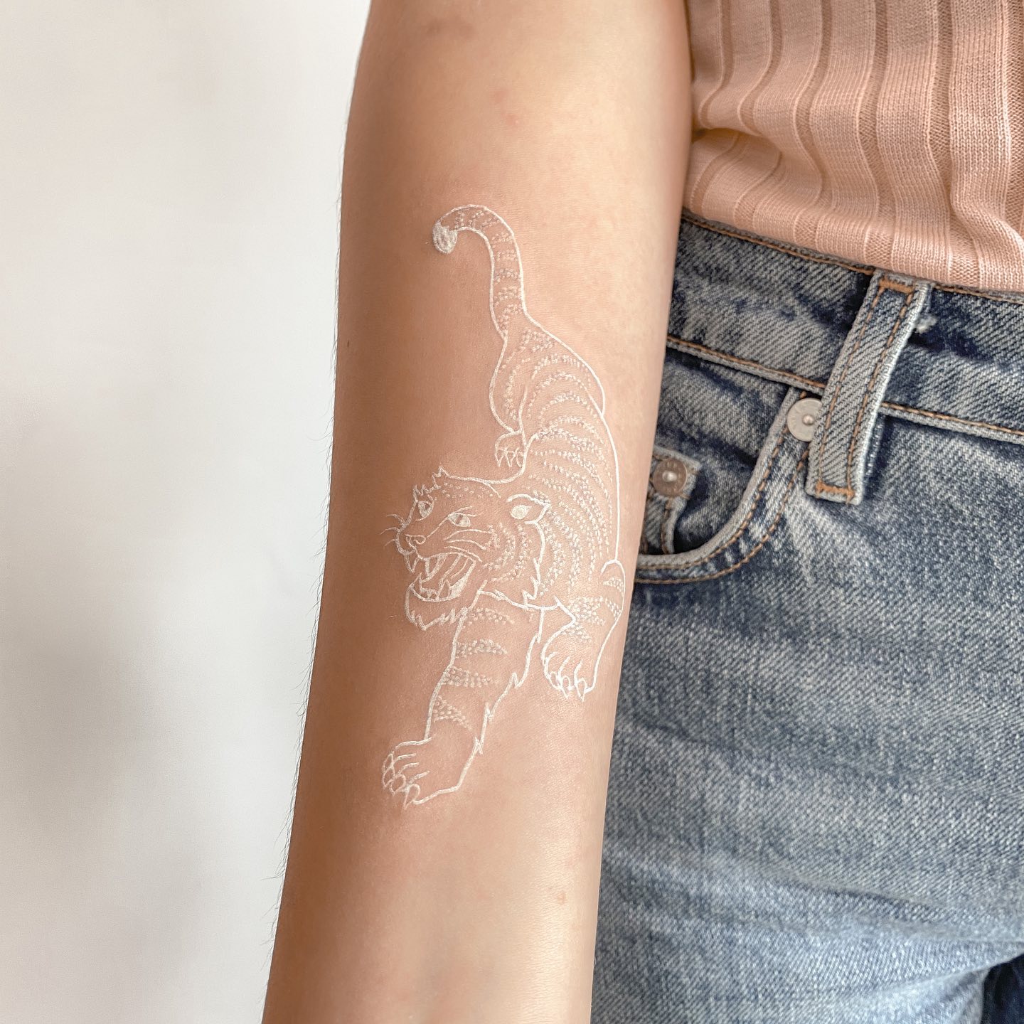 Tiger tattoos represent strength, good luck, wisdom and prosperity to the fullest. They are such majestic creatures and so beautiful. To honor that beauty, a white ink tiger tattoo would be a great way.