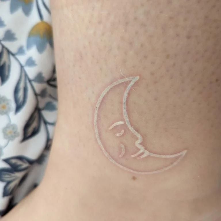 The white ink crescent moon tattoo is really pretty, and I love how it's a small tattoo that you can put anywhere on your body. Don't go too crazy with the size; otherwise, your tattoo could end up looking pretty amateurish.