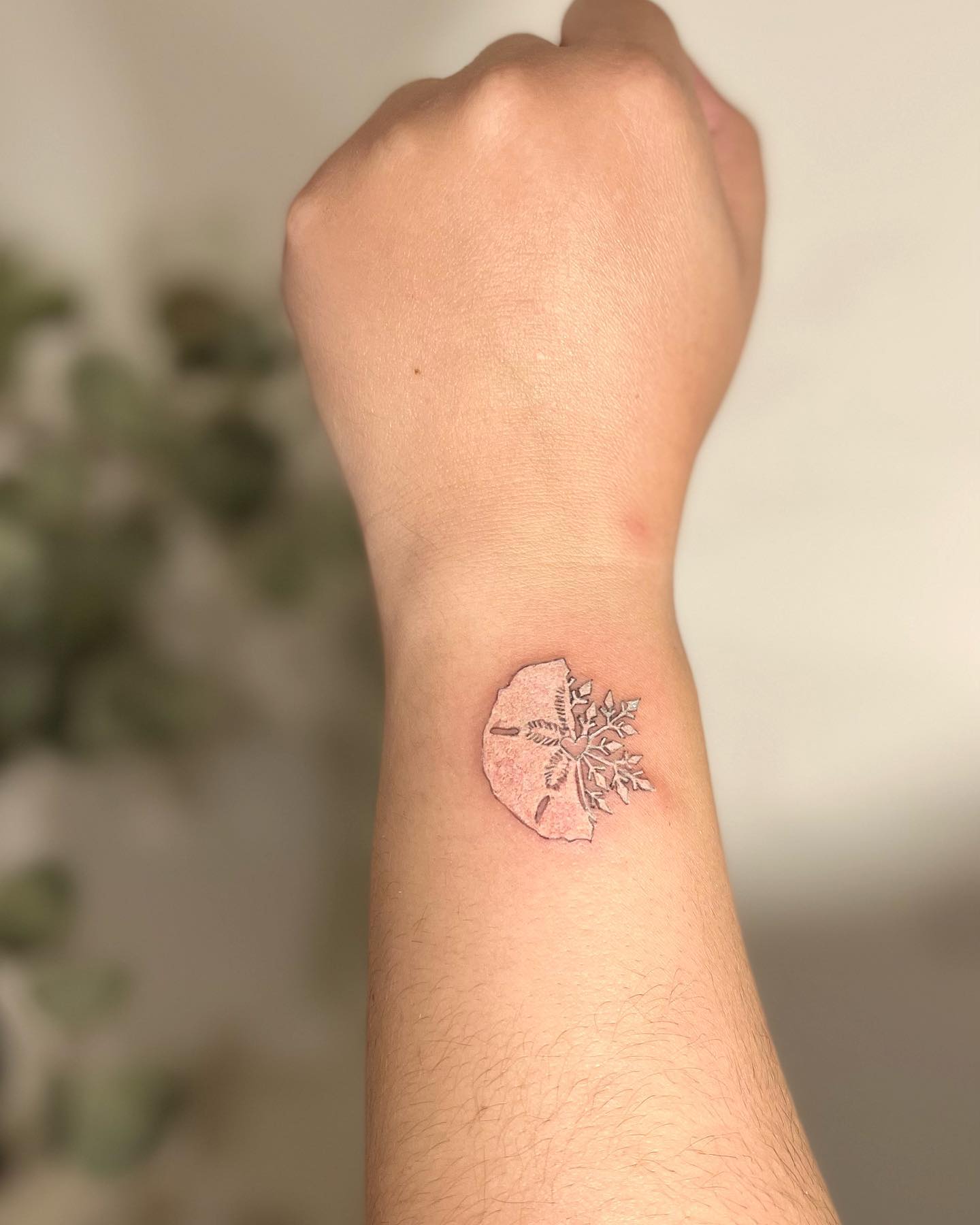 I love the way the snowflake appears from the ice. It's like a fresh blanket of snow, which is exactly what Christmas is about. This tattoo will warm your heart, for sure.