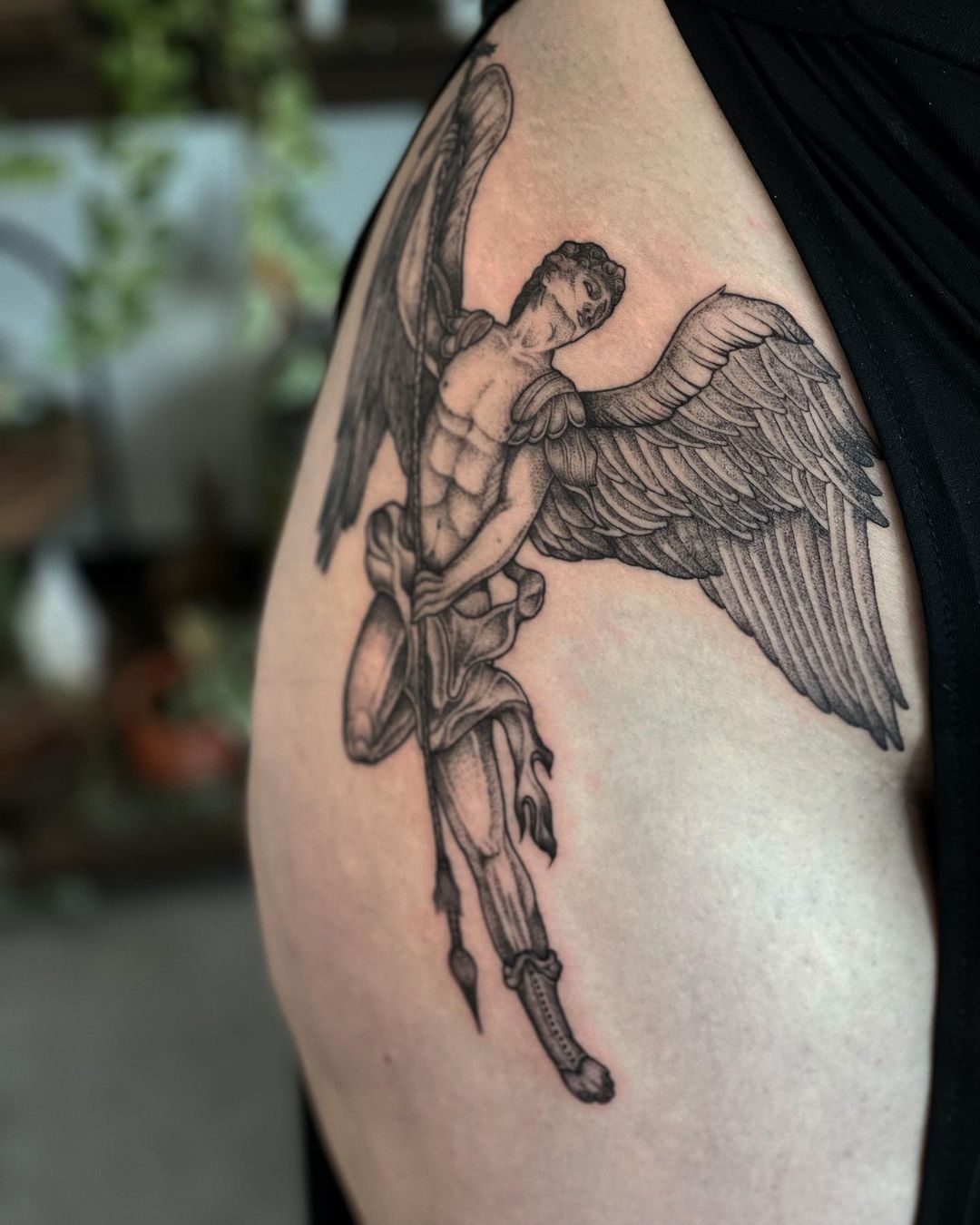 Archangel Michael tattoo located on the forearm black